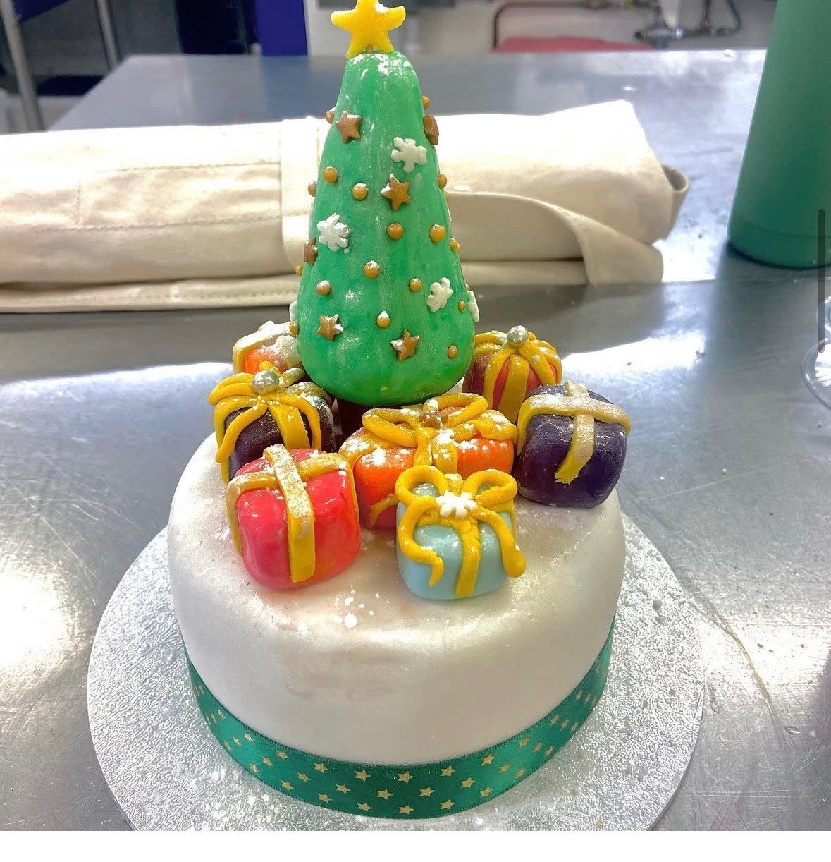 Hand-decorated Christmas tree cake, one of Gabby's signature designs